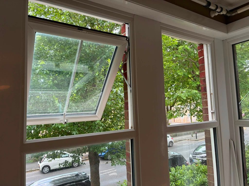 Clean, newly repaired uPVC window open smoothly on new friction stays installed by ASL Locksmiths Eastbourne.